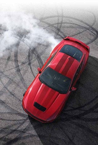 Overhead view of a 2024 Ford Mustang® model with tire tracks on pavement | Sam Scism Ford in Farmington MO
