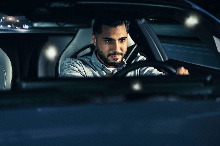 Person sitting in the driver’s seat of a parked 2024 Ford Mustang® coupe | Sam Scism Ford in Farmington MO