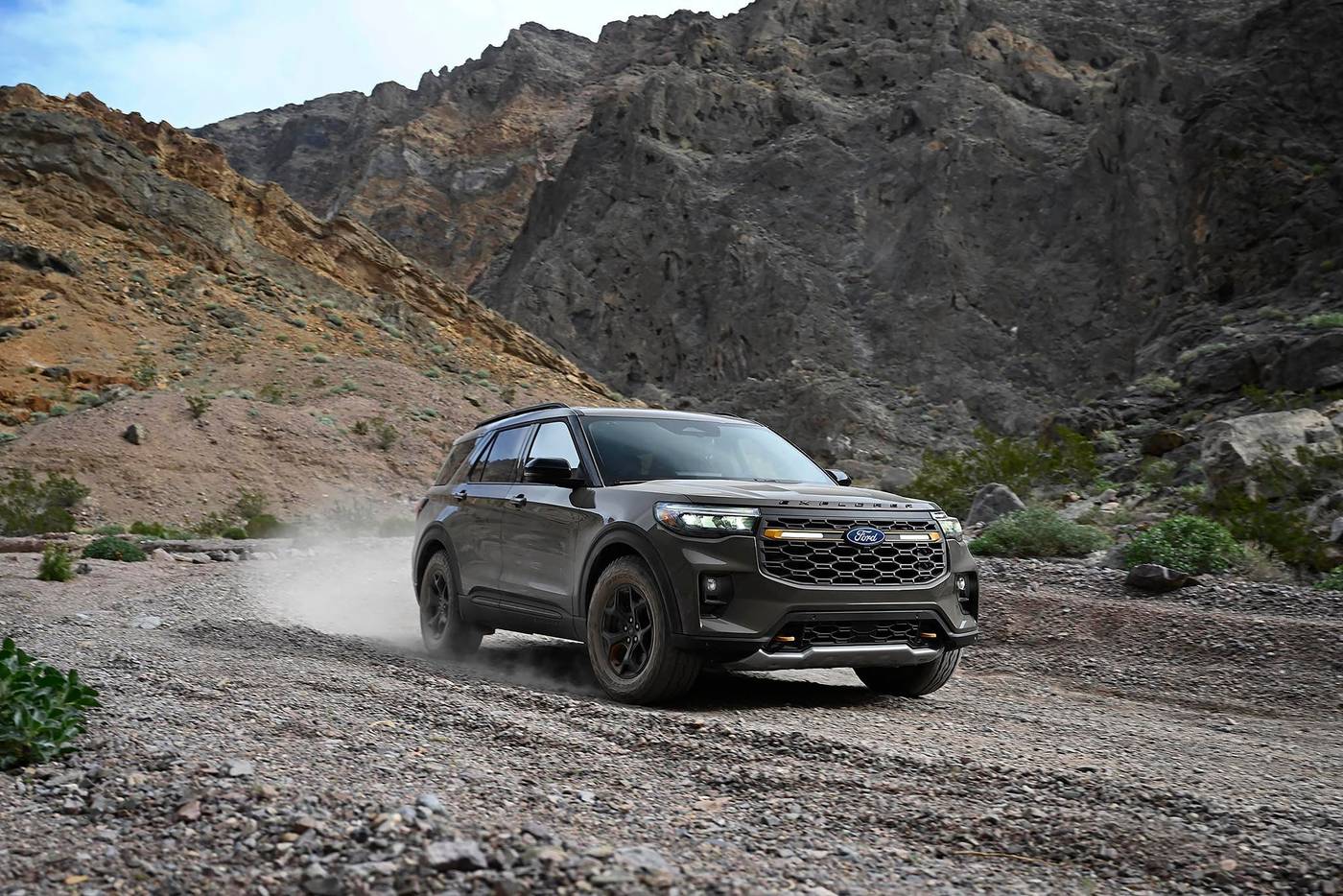 2027 Ford Explorer Tremor kicking up dust on a gravel road through rocky hills 2027 Ford Explorer Tremor kicking up dust on a gravel road through rocky hills, Farmington MO