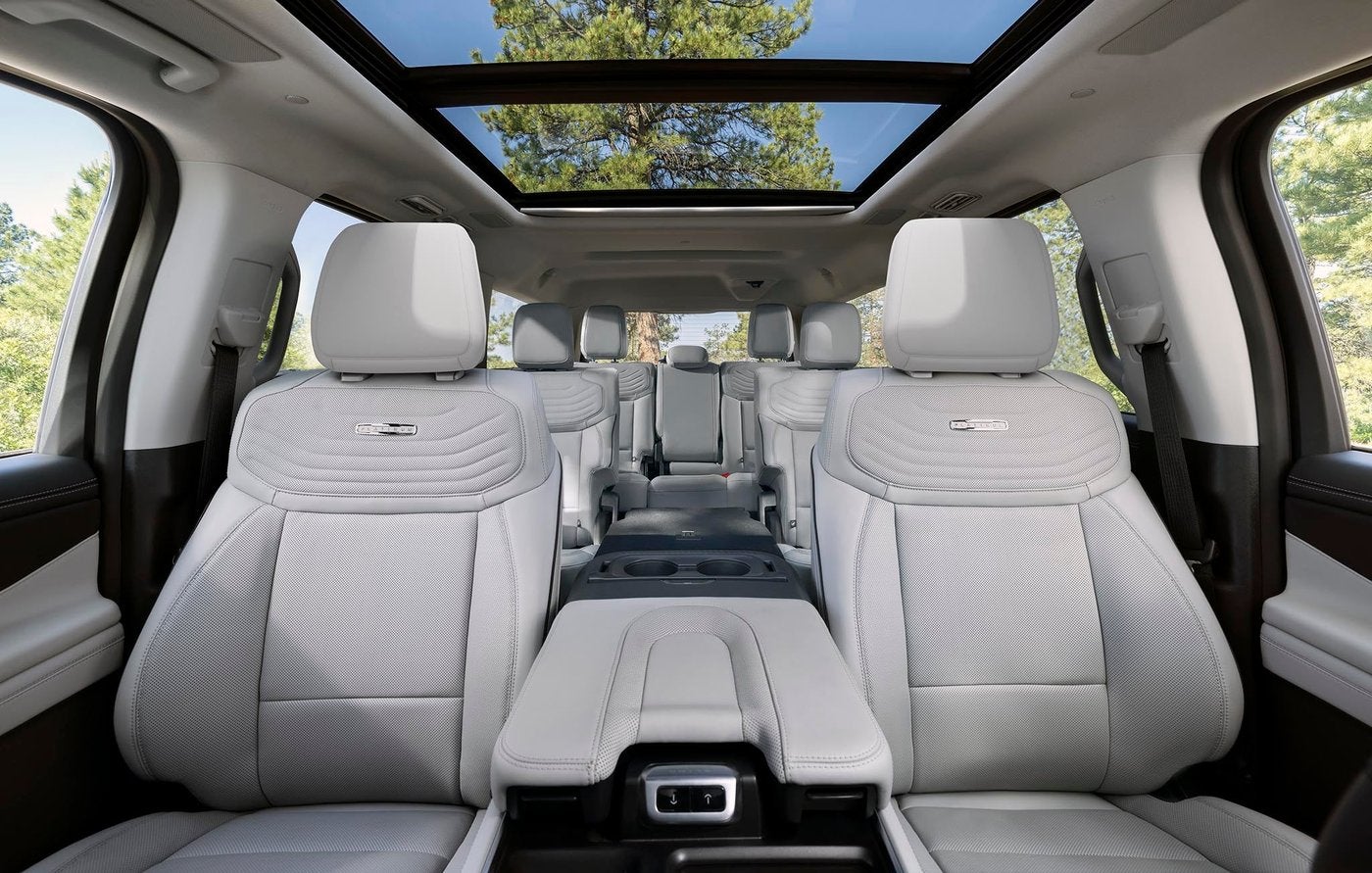 Light gray Ford Expedition Platinum interior with three rows of seats under a panoramic roof, Farmington MO
