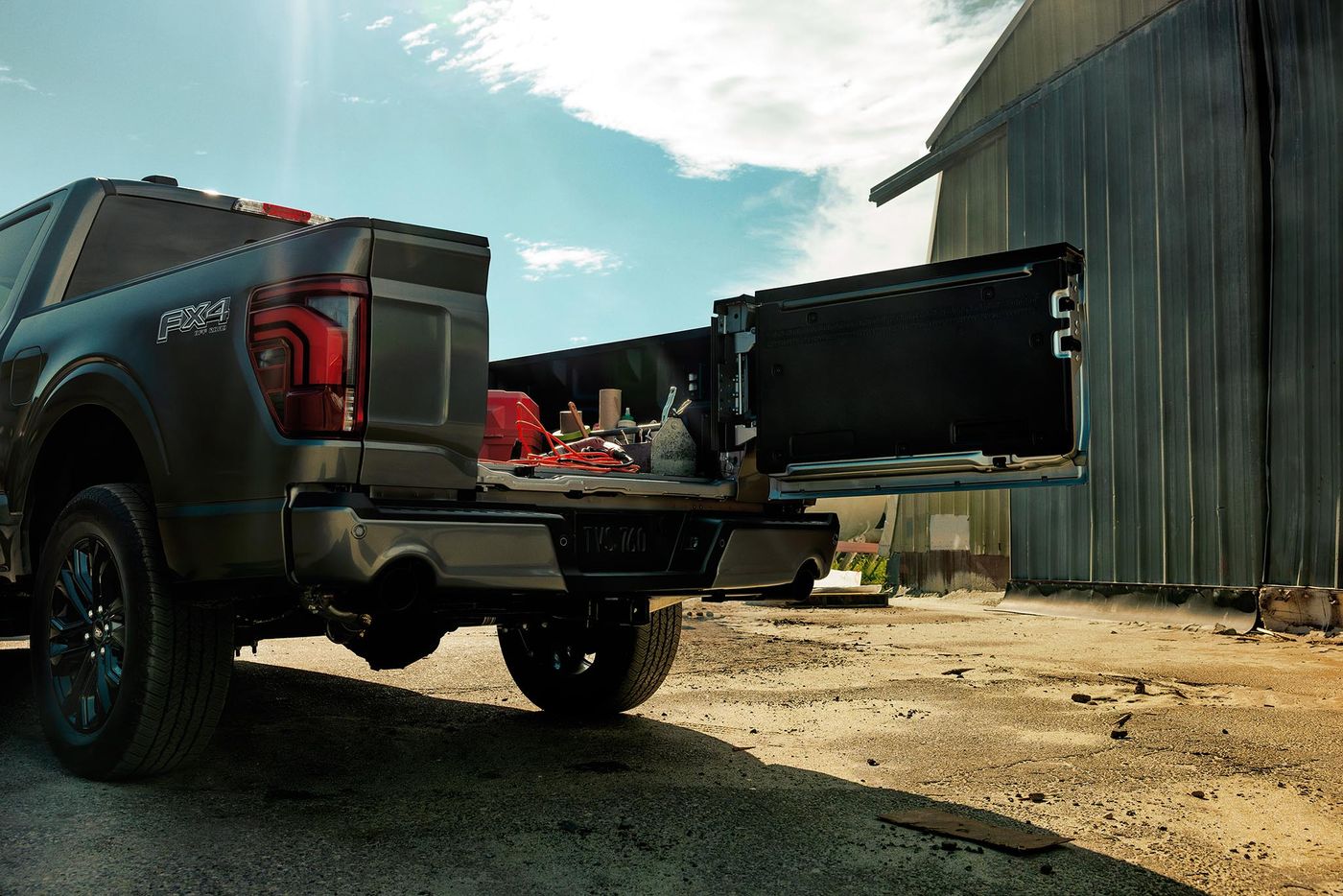 Ford F-150 Pro Access Tailgate swung open at a work site with gear in the bed, fleet work in Farmington MO