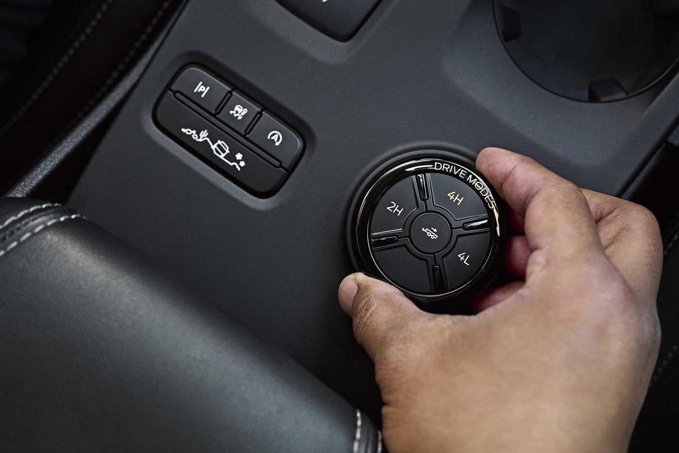 Hand turning a Ford Ranger drive mode dial with 2H Hand turning a Ford Ranger drive mode dial with 2H, 4H and 4L settings, drivetrain care in Farmington MO