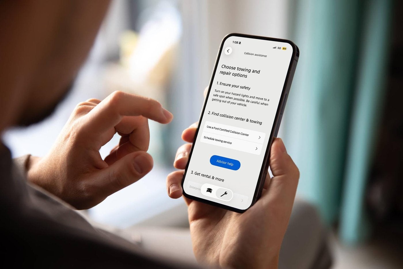 Hands holding a phone with the FordPass app open, an easy way to reach Ford service in Farmington MO